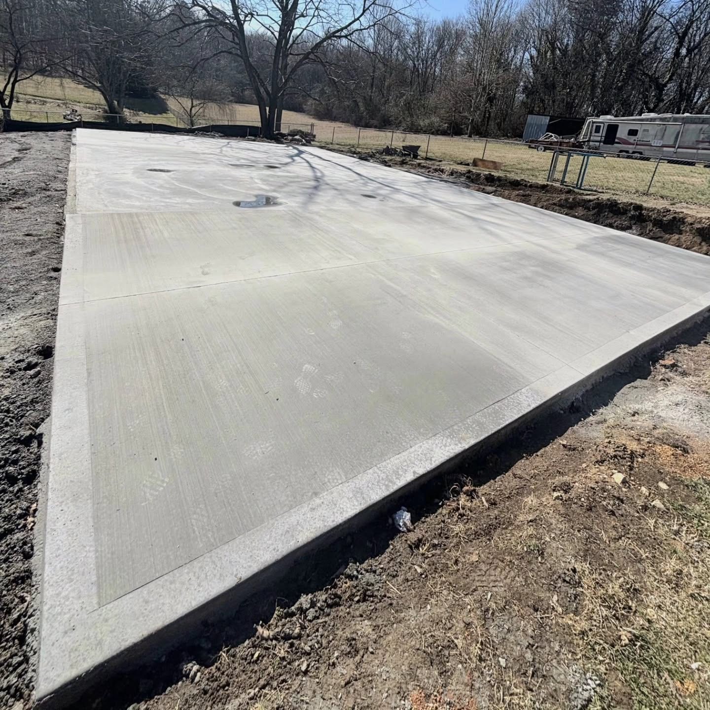 Finished concrete yard pad and flatwork slab